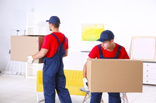 Team safely loading household items into a van