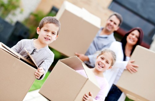 Professional movers handling boxes and furniture in South Harrow